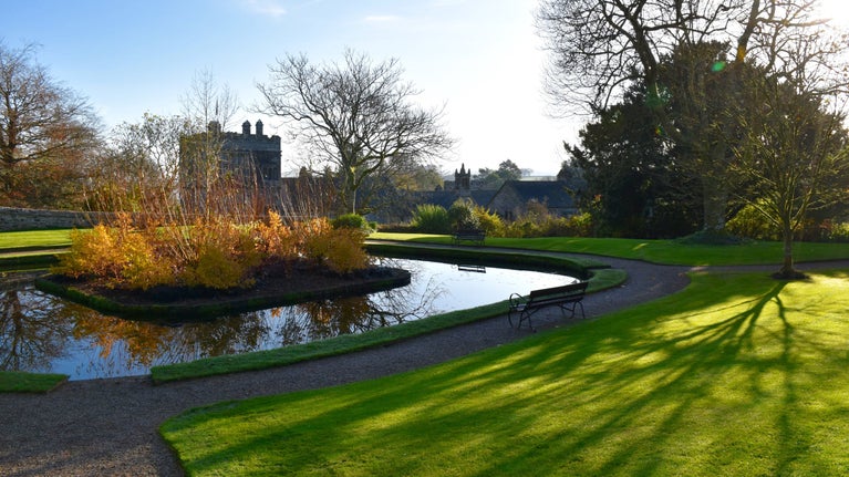 The pond in the Upper Garden in autumn at Cotehele, Cornwall